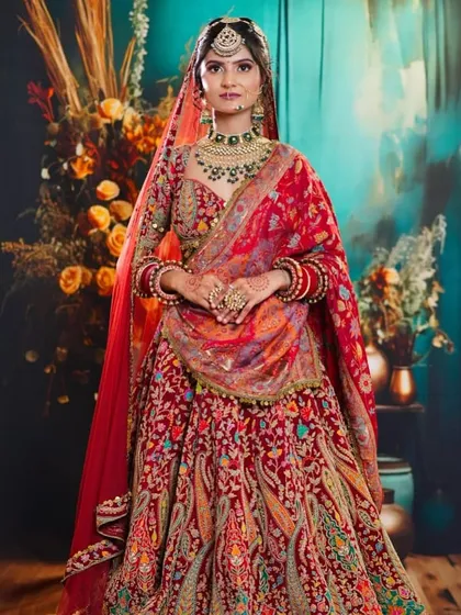 A full shot of the magnificent bridal lehenga and the student's makeup artistry. This is the kind of portfolio piece that helps our graduates secure top jobs.