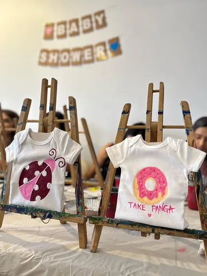 A little glimpse into a baby shower activity I hosted. Guests painted these adorable onesies.