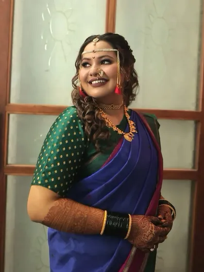 A portrait of modern elegance. This bride's look is a perfect fusion of contemporary hairstyle and traditional attire, creating a unique and captivating style.
