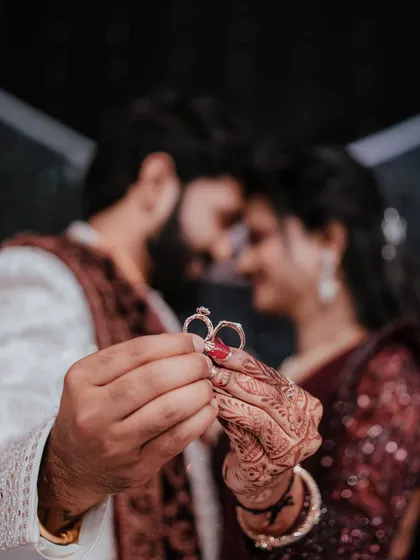 A creative shot focusing on the ultimate symbols of commitment. We love finding unique ways to photograph engagement rings, turning a small detail into a powerful statement about your love story.