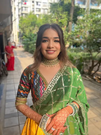 A Mandap Mahurat bride looking fresh and radiant in a green and yellow outfit.