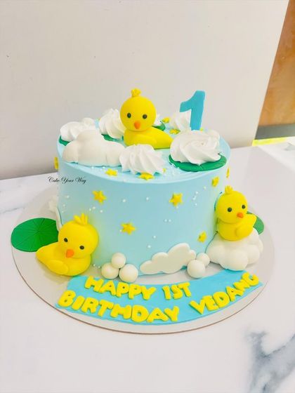 Splish, splash, it’s a ducky bash. This adorable duck-themed cake with fondant clouds and stars is perfect for a first birthday celebration.
