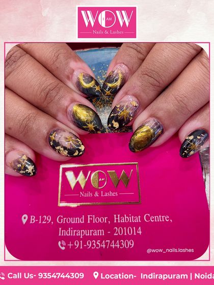 Another view of our celestial black and gold nail art. The combination of deep black, shimmering gold, and delicate star and moon patterns is truly enchanting.