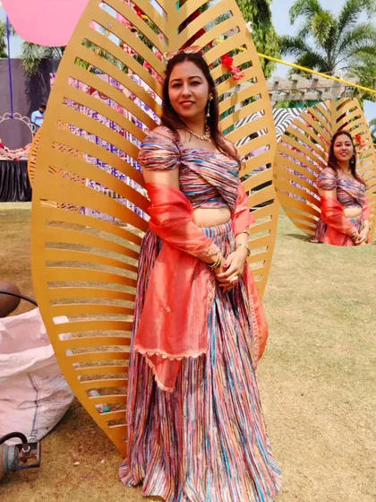 Another shot from the sunny Haldi carnival, posing against a cool, leafy backdrop. The venue was just as energetic as the event.