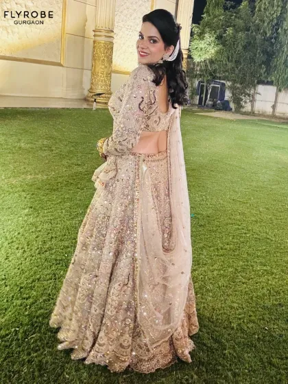 Influencer-approved and ready for you. This shimmering gold lehenga is a guaranteed head-turner, perfect for any grand celebration.
