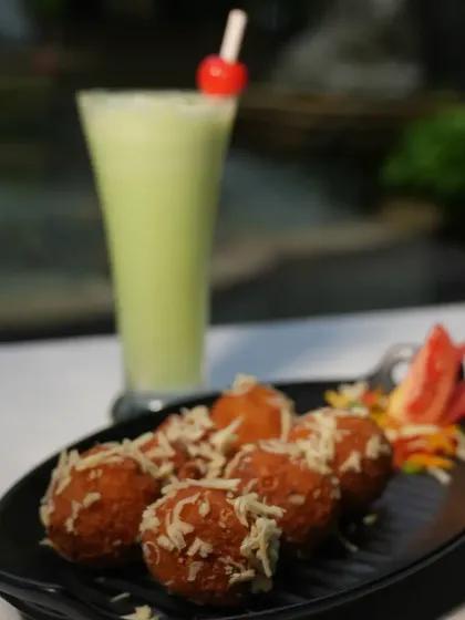 Our Crispy Corn Cheese Balls are a guaranteed crowd-pleaser. They are golden and crunchy on the outside, with a gooey, cheesy corn filling that bursts with flavor.