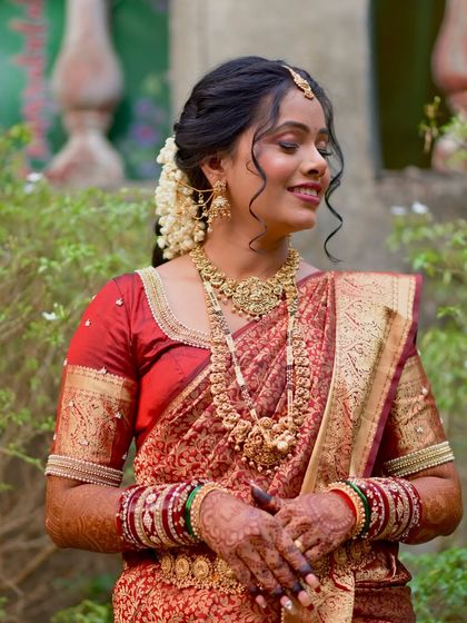 A beautiful portrait of the bride with her hair adorned with fresh flowers.