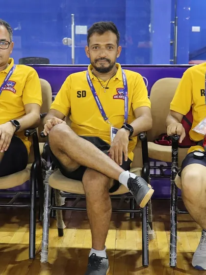 Our coaching and management staff, the backbone of our club, taking a moment during a tournament.