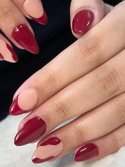 I'm so proud of my students' progress. This professional-looking abstract red set was created by a student just 23 days into her nail course.