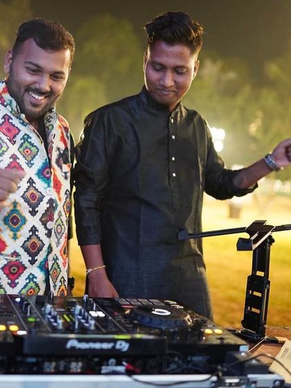 Sharing a fun moment with a friend behind the DJ booth. It's all about good vibes.