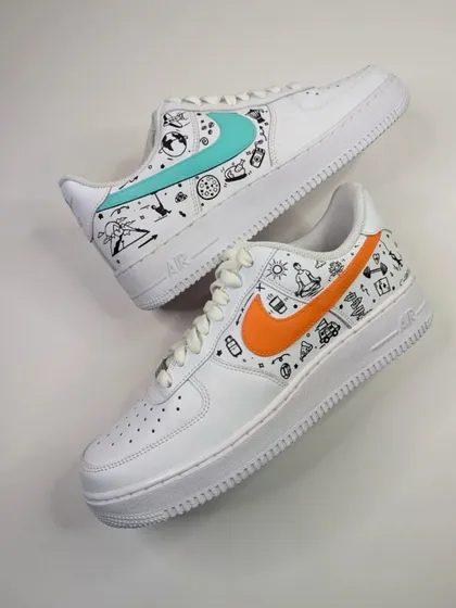 A vibrant doodle Air Force 1 for a client who loves food, travel, and working out. The mismatched swooshes in orange and teal add a fun pop of color.