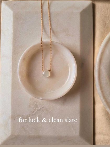 The White Moonstone heart drop pendant is for luck and a clean slate.