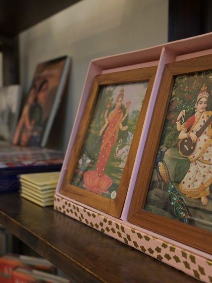 A look at the curated books and mementos available at our gallery shop, including framed prints from the Raja Ravi Varma Heritage Foundation.