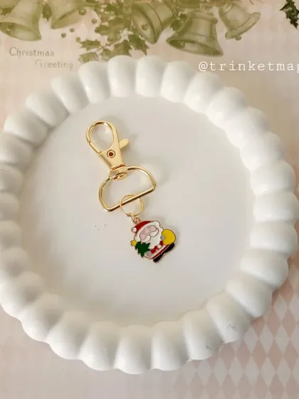 A jolly Santa Claus charm keychain, perfect for your keys or as a small gift for a friend.
