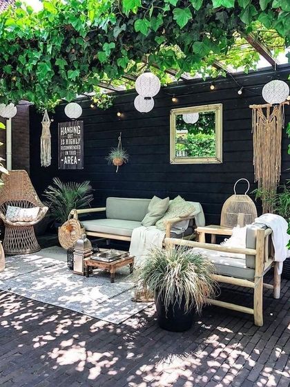 A beautiful small patio with green accents. We can turn any patio into a comfortable and private oasis for you to relax, entertain, and enjoy with family and friends.