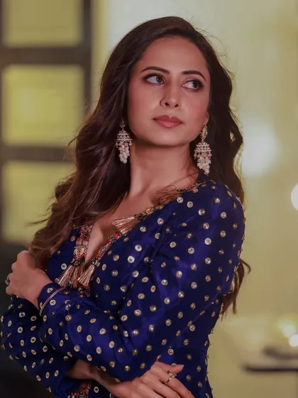 A full shot of Sargun Mehta, where our statement jhumkas add a touch of traditional grace to her modern ethnic wear.