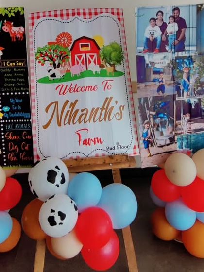 A collection of personalized welcome boards for a farm-themed party, including a milestone chart and a family photo collage.