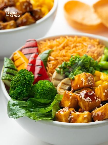 Our Paneer Teriyaki Bowl is a vegetarian delight. It's packed with sesame-glazed paneer, grilled peppers, broccoli, and edamame for a healthy and tasty meal.