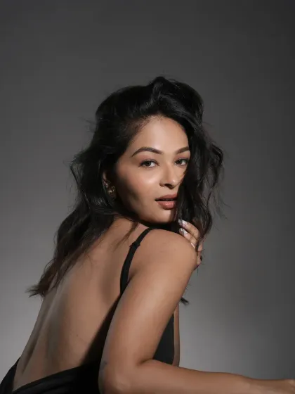 A soft, three-quarter profile showcasing the smooth application and skin-like finish of the makeup. The look is built on a foundation of expertly prepped skin, ensuring it remains flawless throughout a long shoot day.