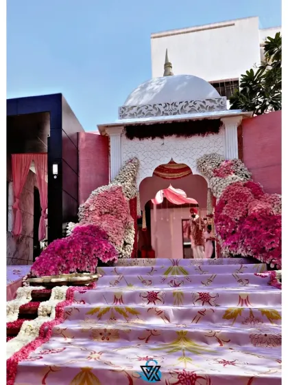 This grand entrance was designed for an Anand Karaj ceremony, creating a breathtaking first impression. I built this custom structure, complete with a traditional dome and cascading floral arrangements in shades of pink, to welcome guests into a sacred space filled with love and celebration.