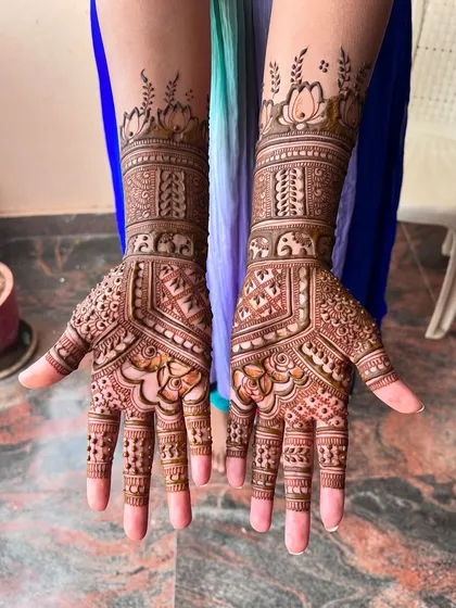 Another angle of the engagement mehendi, showing the intricate details on the palms and fingers.