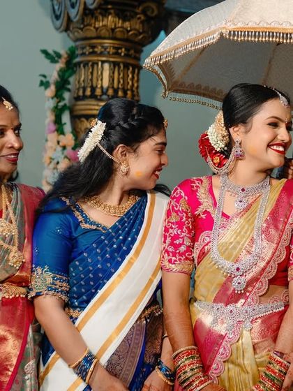 A bride sharing a laugh with her bridesmaids and family. We capture the important relationships and friendships on your wedding day.