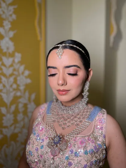 This is a bridal look I created for a TV commercial. The makeup is soft and neutral, with a focus on pink tones to match the pastel outfit.