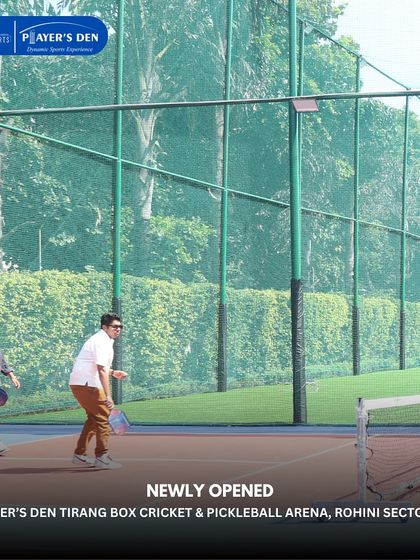 Players engaged in a pickleball rally during the inauguration of our Rohini arena. The surrounding greenery provides a pleasant and refreshing atmosphere for a game.
