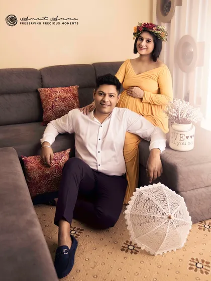 A relaxed and happy portrait at home. This image shows that a comfortable sofa and natural light are all you need to capture the warmth and love of this special time.