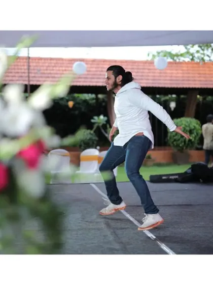 A candid moment captured while dancing at an outdoor wedding event. My goal is always to be in the moment and ensure the energy is high.