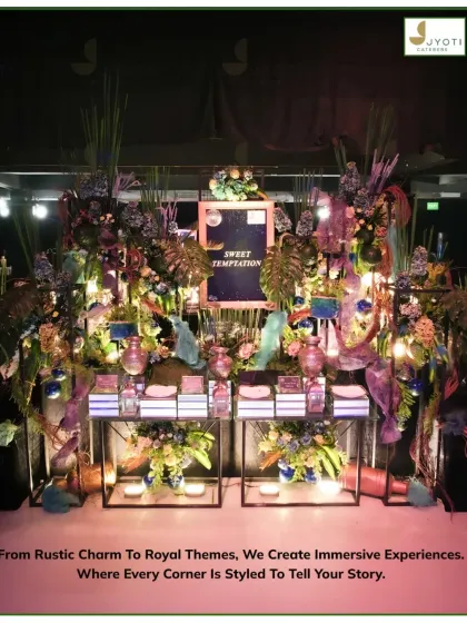 A 'Sweet Temptation' dessert counter styled with a tropical, bohemian vibe. The setup features lush foliage, pampas grass, and eclectic decor to create an immersive experience.