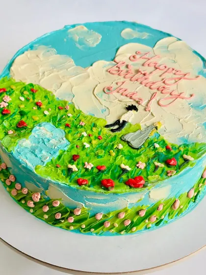 We turn your stories into edible art. This hand-painted buttercream cake tells a countryside love story, with a dreamy landscape of fields, clouds, and flowers created entirely with a palette knife. It’s a beautiful way to celebrate a special connection.