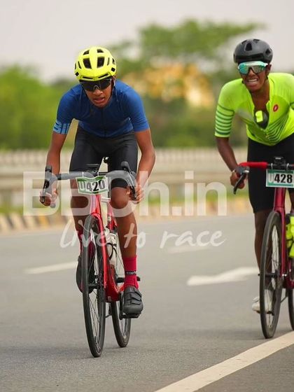 Two U-18 riders, battling it out for position.