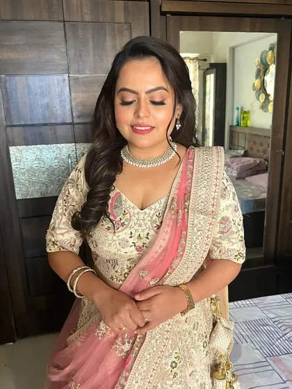 A close-up with eyes closed, this shot shows the soft, blended eyeshadow and the beautiful dewy finish on the skin. It's a perfect look for a romantic engagement party.