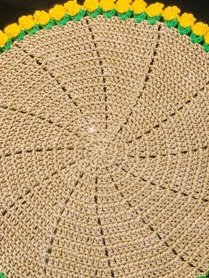 This doily features a sunny yellow tulip border, which is perfect for brightening up a room.