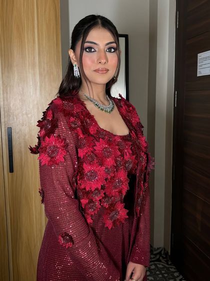 Another angle of Janvi's Roka look, showing off the sleek ponytail and the intricate details of her outfit.