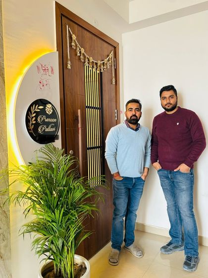 A happy handover moment with our client at ATS Nobility, standing proudly in front of their new main door.