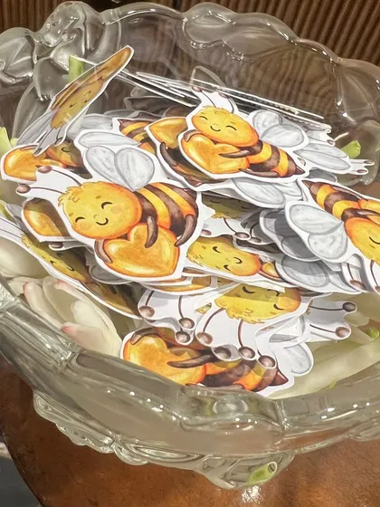 A collection of adorable honeybee-themed cutouts for a "Baby in Bloom" or "Mommy to Bee" shower.
