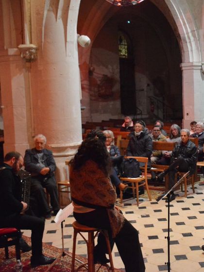 An interactive moment during a 'Little Italy' performance in a beautiful, historic church. We often take time to connect with our audience, sharing stories and insights about the music.