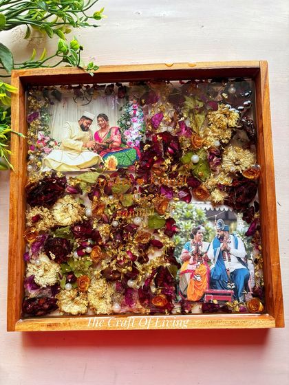 This is one of my favorite creations. A beautiful wedding varmala, with its rich colors and textures, preserved forever in a solid teak wood frame. I included two of the couple's favorite photos to complete their story.