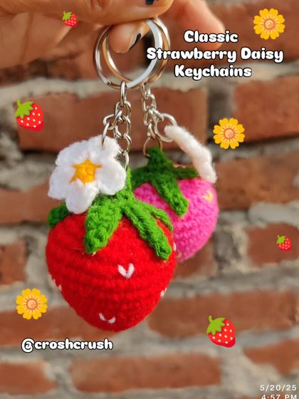 Sweet strawberry and daisy keychains. These come in red, pink, and purple, each with a little white flower.