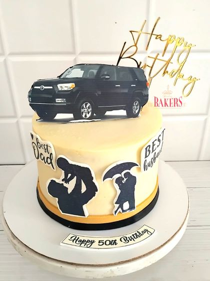 This cake was for Vikram's 50th birthday, a tribute to his love for road trips and cars. I used edible silhouettes to depict his roles as a husband and father, making it a deeply personal, no-fondant fresh fruit cake.