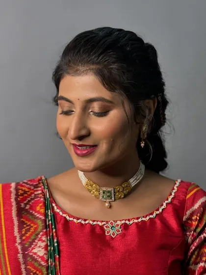 A close-up showing the soft eye makeup and perfectly blended skin. This look is ideal for daytime events like a wedding pooja.
