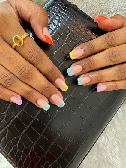 Colorful French tips are perfect for work. This set is sophisticated yet fun and vibrant for our client.