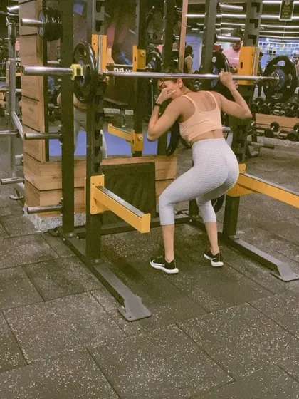 A photo from my online coaching announcement, highlighting my focus on strength training with exercises like the back squat.