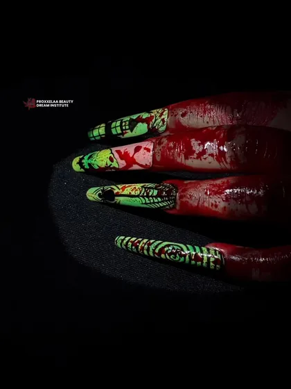 A dramatic and gory Halloween design, featuring bloody effects over a green and black patterned nail for a truly scary look.