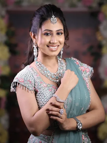 A happy and confident model, her smile lighting up the frame as she shows off her beautiful jewellery.