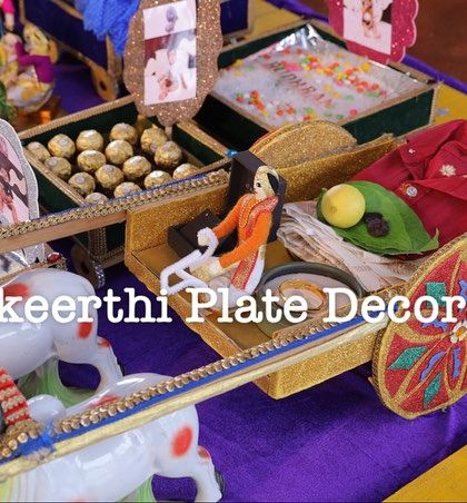 A close-up of one of my thematic creations for an ear piercing ceremony, a decorated bullock cart carrying seer items.