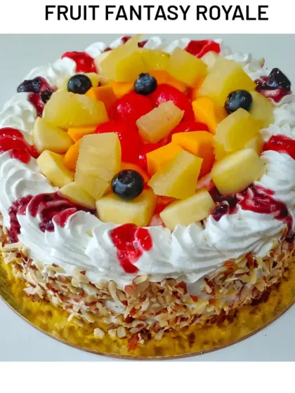 My Fruit Fantasy Royale cake. A light and airy vanilla sponge layered with fresh cream and a medley of seasonal fruits, perfect for those who prefer a non-chocolate option.