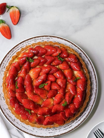 An overhead shot of our 9-inch Mahabaleshwar strawberry tart. This is available for home delivery and makes a stunning dessert for a family gathering.